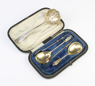 A cased set of 2 silver caddy spoons and tongs with apostle terminals London 1868 and a George III silver sifter spoon London 1805 166 grams