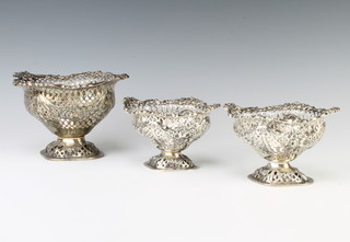 A set of 3 Victorian silver bon bon dishes of boat form with pierced scroll decoration and waisted stems, London 1900 maker Charles Stuart Harris 610 grams