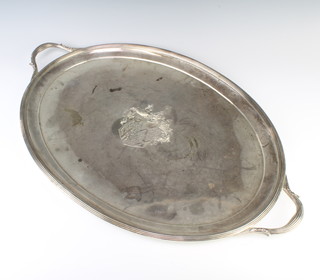 A Victorian silver oval 2 handled tray with chased armorial London 1887, maker Hunt and Roskell, 75cm, 3280 grams 