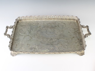 A 19th Century French rectangular silver galleried tray with pierced scroll border and rustic handles, 62cm,  2700 grams 