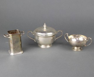 A Tiffany and Co sterling silver 2 handled bowl and cover, a silver holder and 2 handled cup 740 grams