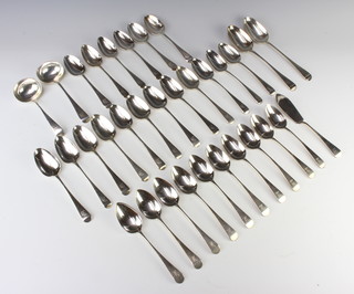 A quantity of Old English pattern silver table flatware with chased armorial, comprising 12 dessert spoons, 16 dinner spoons, 2 ladles, 2 table spoons and a fish knife, mixed dates, 1460 grams 