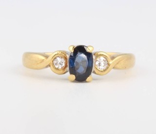 An 18ct yellow gold sapphire and diamond ring, size J