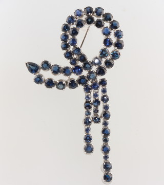A vintage rhodium plated silver, blue gem set  open brooch containing 65 brilliant and pear cut stones 70mm x 40mm 
