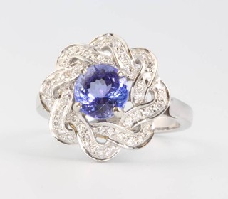A 14ct white gold tanzanite and diamond cluster ring size O 1/2
