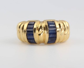 An 18ct yellow gold baguette cut sapphire ring, size M 