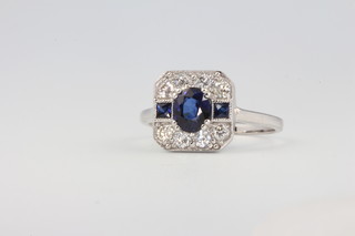 An 18ct white gold Art Deco style sapphire and diamond cluster ring size N 