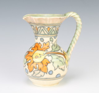 A Charlotte Rhead style Crown Ducal jug the cream ground decorated with flowers 13cm 