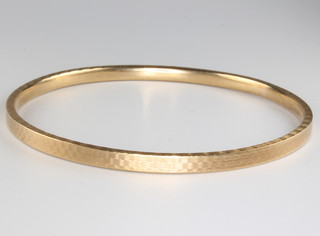 A 9ct yellow gold engine turned bangle 21.3 grams 