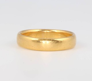 A 22ct yellow gold wedding band 6.4 grams, size Q 1/2