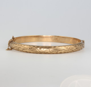 A 9ct yellow gold chased bangle 8.1 grams
