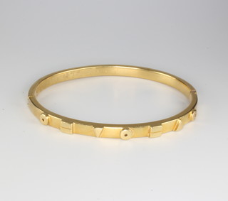An 18ct yellow gold bangle with geometric decoration 15.4 grams