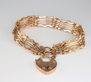 A 9ct yellow gold fancy link gate bracelet with padlock 20 grams