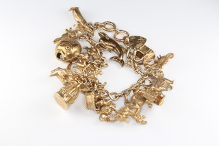A 9ct yellow gold charm bracelet 54.9 grams