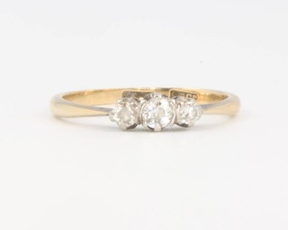 An 18ct 3 stone diamond ring size M 