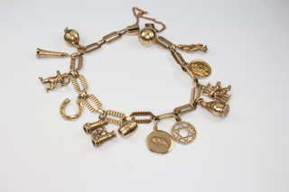 A 9ct yellow gold charm bracelet 26.5 grams