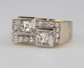 An 18ct yellow and white gold diamond Art Deco style cocktail ring the centre 2 stones approx. 1ct surrounded by 14 brilliant cut diamonds approx 0.35ct size S 1/2 