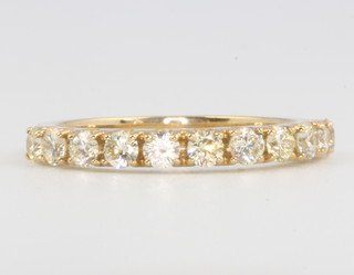 A 9ct yellow gold diamond set half eternity ring 0.76ct, size L 1/2