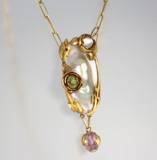 A 14ct yellow gold Art Nouveau pendant set with a blister pearl, peridot, moonstone and amethyst on a flat link chain, signed Kalo  