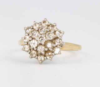 An 18ct yellow gold gem set cluster ring size O 