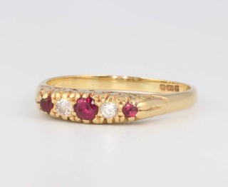 A 14ct yellow gold ruby and diamond ring size T