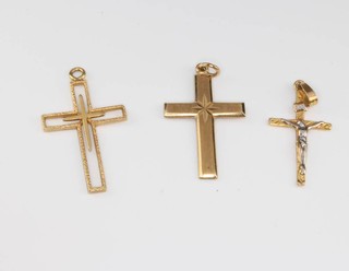Three 9ct yellow gold cross pendants 3.9 grams