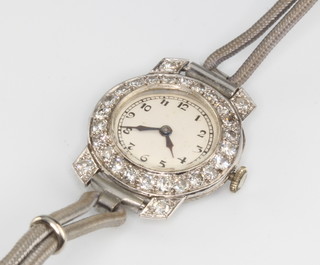 An Art Deco platinum and diamond cocktail watch with 28 brilliant cut diamonds 