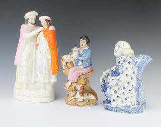 A 19th Century blue and white jug in the form of a seated gentleman with a lamp at his feet 23cm, a Staffordshire figure of a boy with sheep 27cm and do. group Prodigal's Return 37cm 