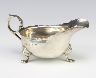 A Victorian silver sauce boat with S scroll handle and pad feet Birmingham 1895, 84 grams