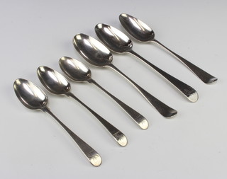 A George III silver table spoon, 2 others and 3 dessert spoons 286 grams