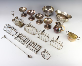 A pair of silver plated 7 bar toast racks, 1 other pair, 3 others, a repousse vase, 4 coups and minor plated items 