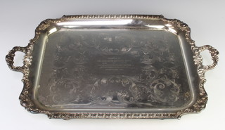 A silver plated rectangular 2 handled tray with scroll decoration 61cm
