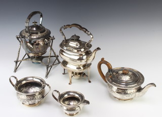 A Victorian silver plated tea kettle on rustic stand with burner, 1 other and a 3 piece plated tea set