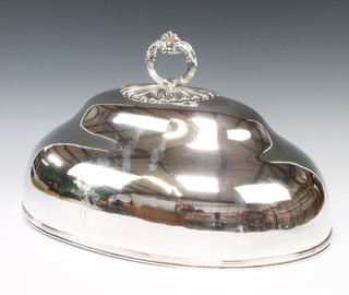 A Victorian oval silver plated meat cover with scroll handle and engraved crest maker T & J Creswick 26cm H 30cm W 48cm D 