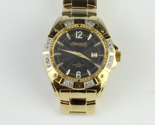 A gentleman's gilt cased Ingersoll Gems Pilot calendar wristwatch on a gilt bracelet, boxed