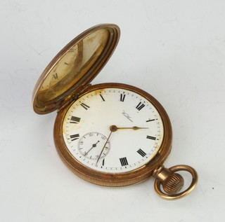 A gold plated hunter pocket watch with seconds at 6 o'clock, the dial inscribed Waltham  