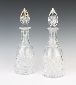 A pair of mallet shaped decanters and stoppers 30cm 