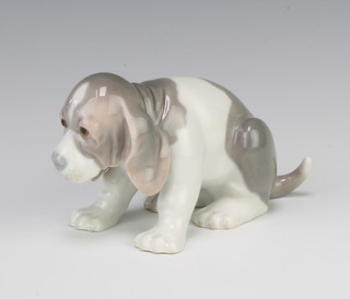 A Lladro figure of a crouching hound 15.5cm 