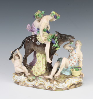 A 19th Century Meissen allegorical group of The Drunken Silenus  on a donkey with three attendants, raised on a rococo base with underglaze mark and inscribed 2724 possibly by Ernst August 20cm 