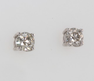 A pair of 18ct white gold single stone diamond ear studs, approx. 0.8ct 