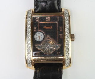 A gentleman's Ingersoll gilt cased Art Deco style white topaz set dress watch with subsidiary dial and visible movement, boxed