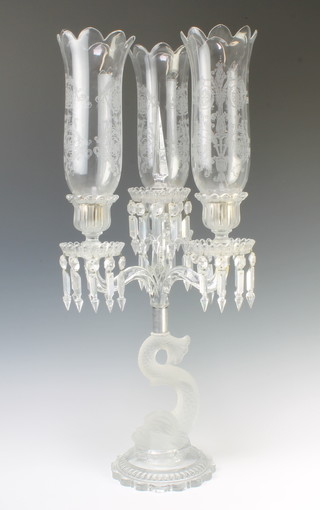 A Baccarat Crystal 3 light candelabrum with etched elongated shades, the pans with faceted drops, raised on a serpent base 70cm h 