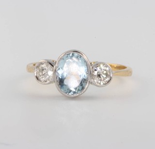 An 18ct white gold aquamarine and diamond 3 stone ring size P 1/2