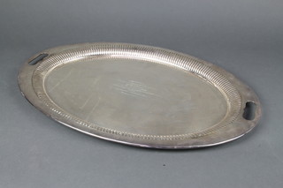 An oval silver plated 2 handled tray with presentation inscription 61cm 