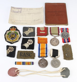 A group of medals to N.Summers late N.Z.E.F comprising New Zealand Territorial 12 Year Service medal, a British War medal 72276 SJT.M.Summers N.Z.E.F, a New Zealand 1939-45 Service medal and War medal, together with minor badges, dog tags and unrelated service book 