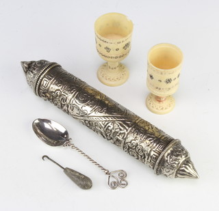 A pair of late 19th Century Indian turned ivory cups with geometric decoration and minor items 