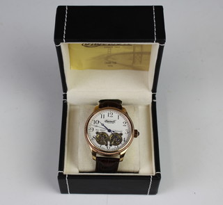 A gentleman's gilt cased Ingersoll twin balance automatic wristwatch with leather strap, boxed