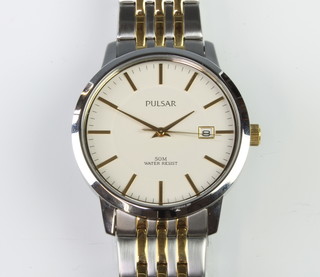 A gentleman's steel case bi-metallic Pulsar calendar wristwatch on a do. bracelet, boxed