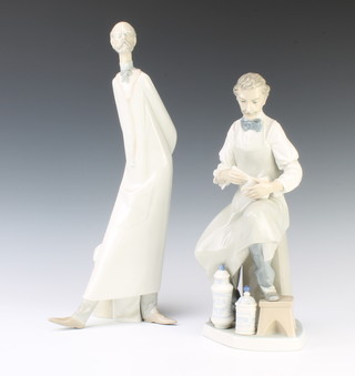 A Lladro figure of a chemist 31cm and a do. figure of a doctor 39cm both by the sculptor Salvatore Furio