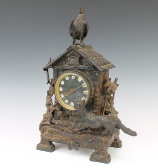 A French 19th Century striking mantel clock with Roman numerals contained in a spelter case decorated a cockerel and fox 